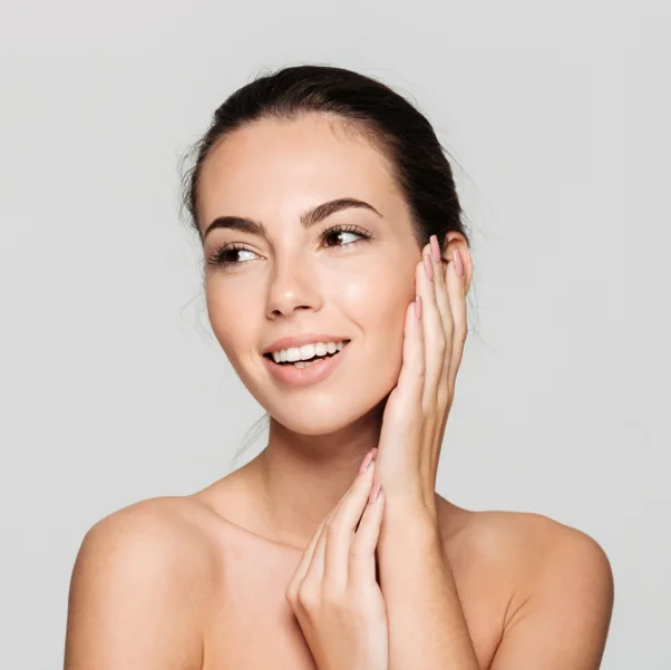 a woman touching her face