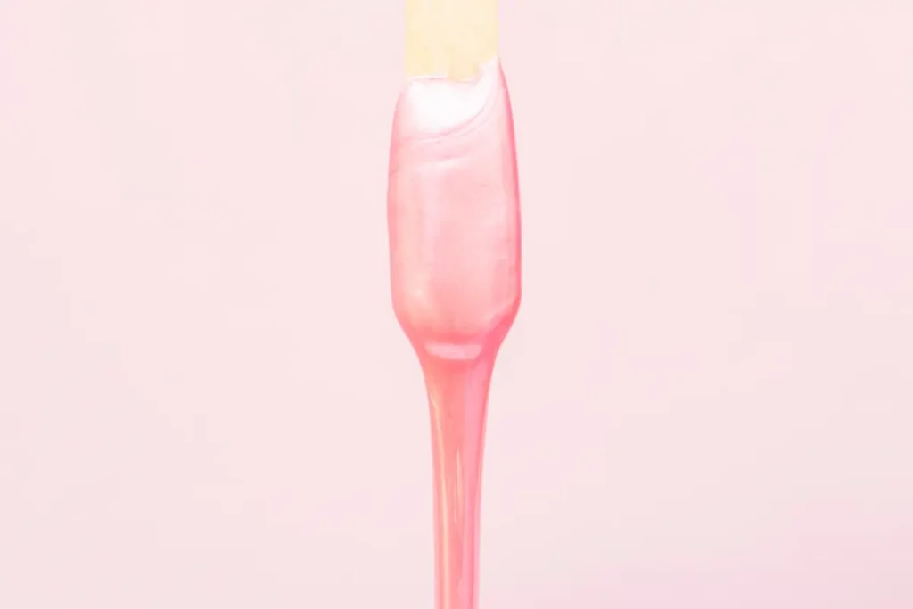 a pink liquid on a stick